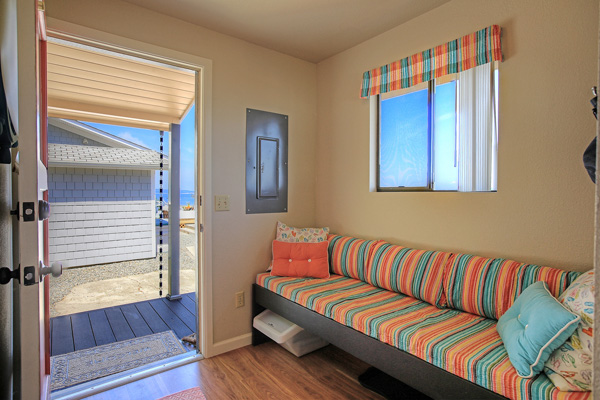 The mudroom/entry at The Beach House at Tyee has a padded bench, handy for when you're kicking off sandy shoes.